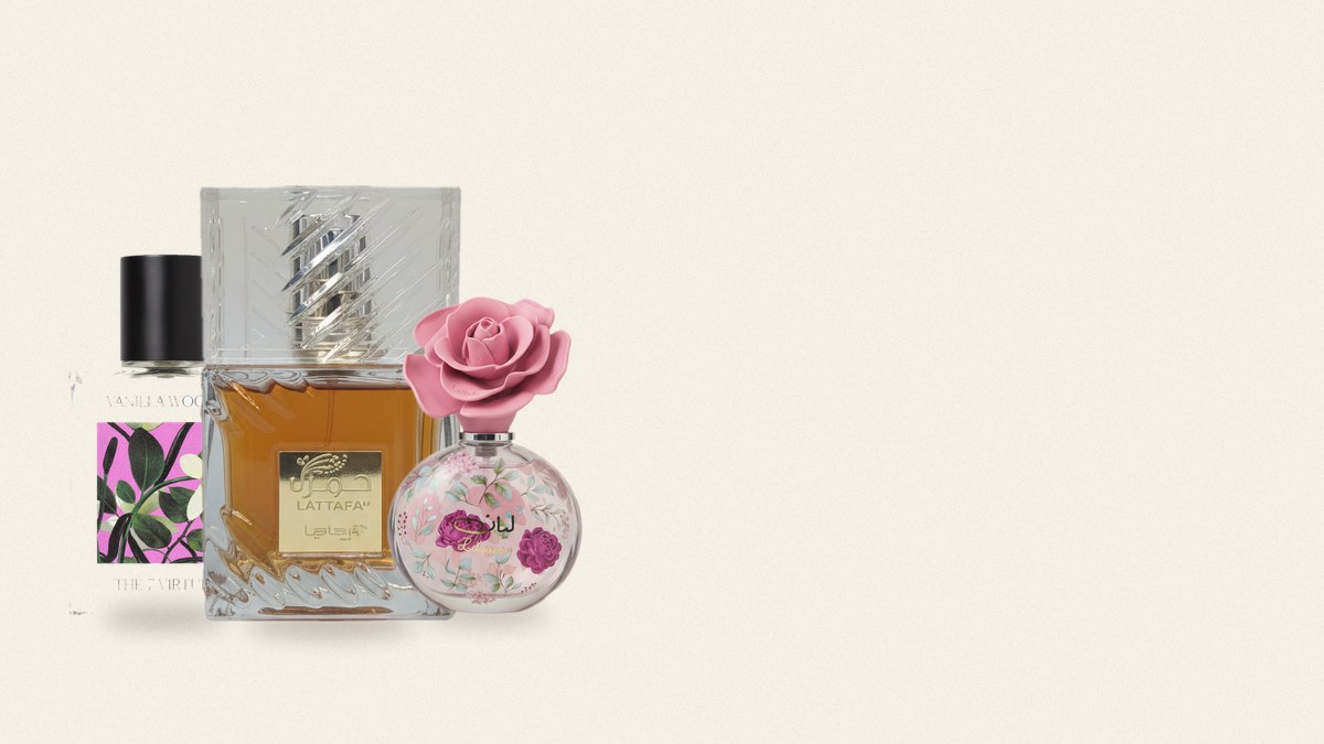 A small, curated set of perfume bottles spaced apart on a light surface